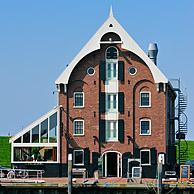 The historical warehouse / storehouse / entrepôt is now a fish restaurant in the harbour of Oudeschild, Texel, the Netherlands
